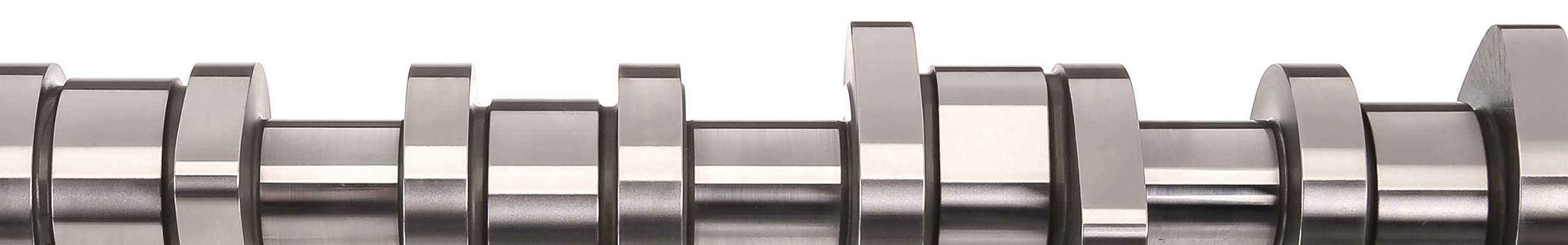 Detailaufnahme einer präzise gefertigten Nockenwelle von MFT Motoren und Fahrzeugtechnik GmbH.
